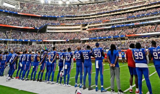 Buffalo Bills players stand for the national anthem before their against the Los Angeles Rams on Thursday at SoFi Stadium in Inglewood, California.