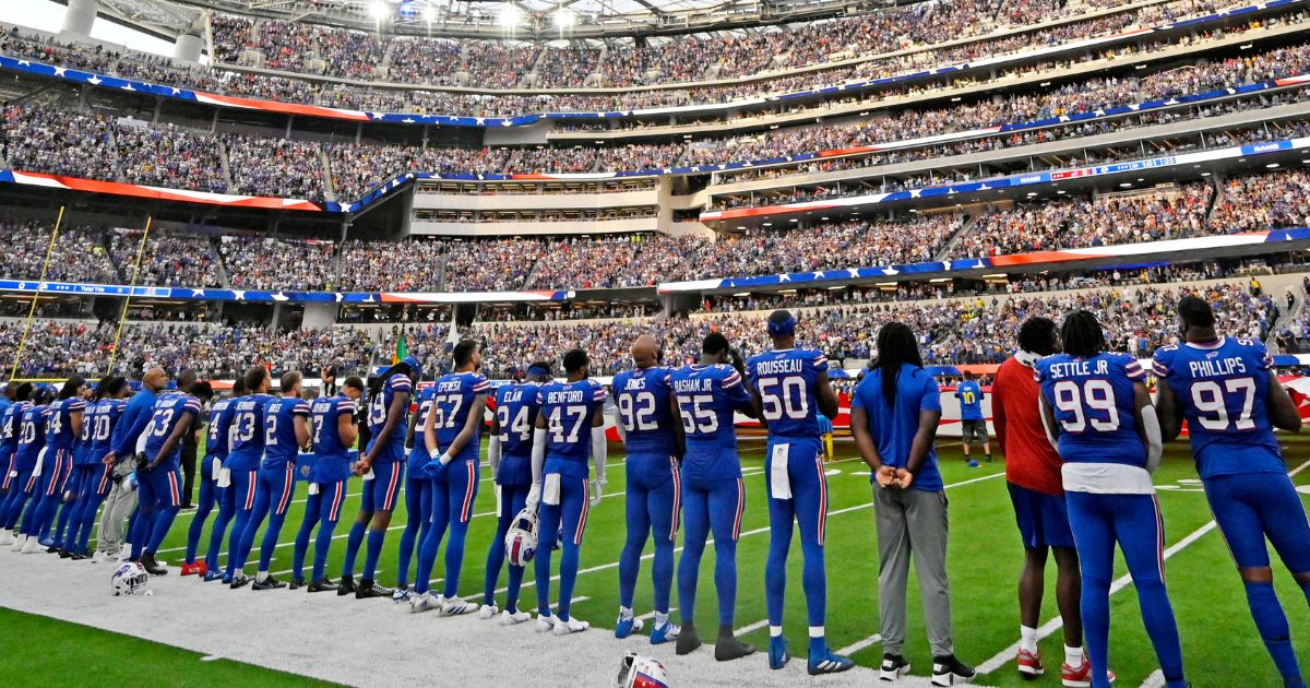 Buffalo Bills players stand for the national anthem before their against the Los Angeles Rams on Thursday at SoFi Stadium in Inglewood, California.
