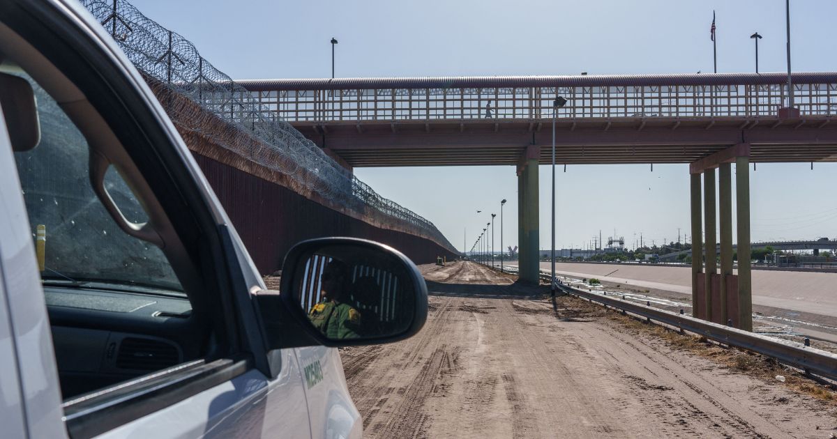 A United States Border Patrol vehicle is pictured next to the border wall in downtown El Paso, Texas on June 3.
