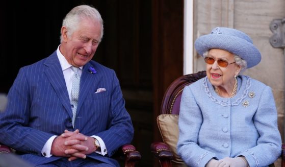 Then-Prince Charles and Queen Elizabeth II are seen in the gardens of the Palace of Holyroodhouse in Edinburgh, Scotland, on June 30.