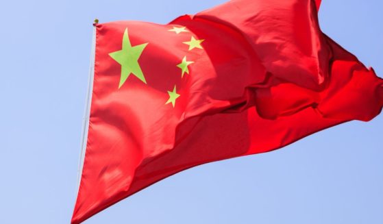 A Chinese flag flies in this stock image.