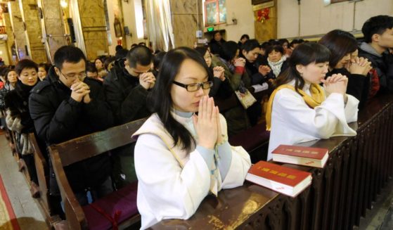 A congregation of Chinese Catholics prays at a Catholic church in Beijing on Dec. 24, 2012.