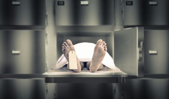 A stock photo depicts a corpse in a morgue.