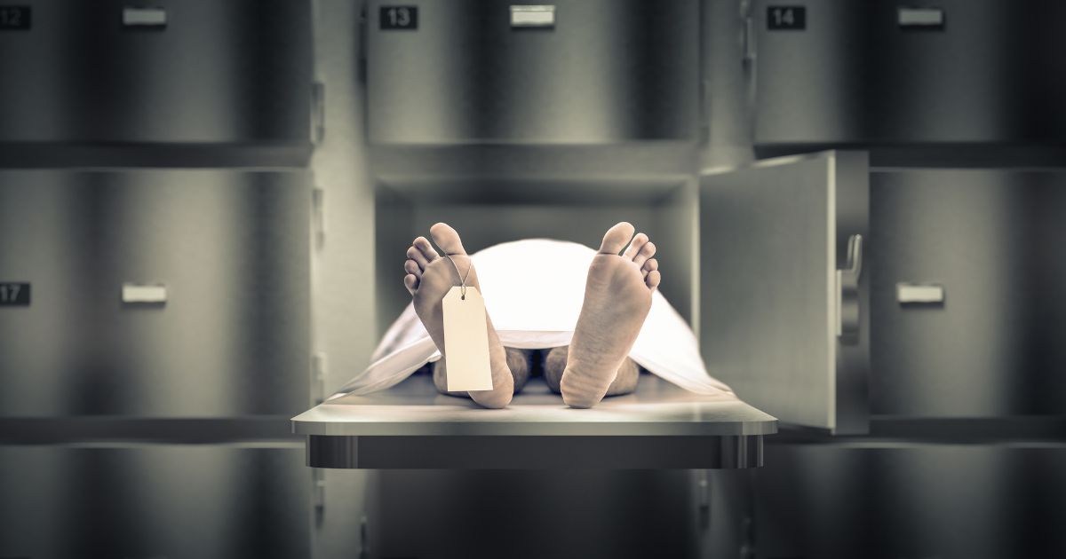 A stock photo depicts a corpse in a morgue.