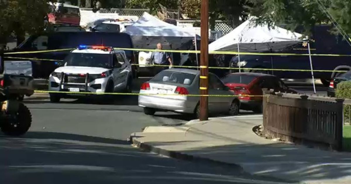 Authorities work the scene of killing in San Carlos, California, on Thursday.