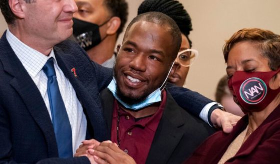 Donald Williams, a key witness in the murder trial against former Minneapolis police Officer Derek Chauvin in the 2020 killing of George Floyd, is seen smiling during a news conference after Chauvin's conviction in April 2021. Williams was arrested on a charge of domestic assault this week.