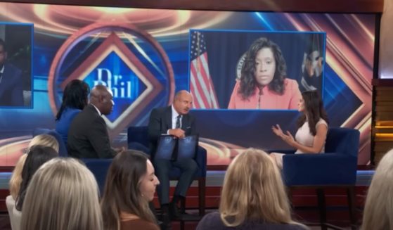 Lila Rose, right, the founder and president of Live Action, speaks to the host and other panelists about abortion on "Dr. Phil."