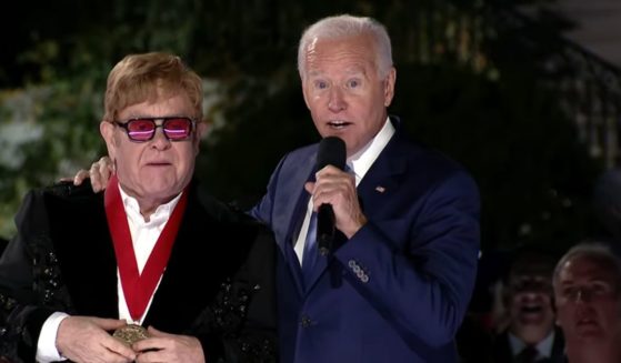 Sir Elton John receives the National Humanities Medal from President Joe Biden on Friday.