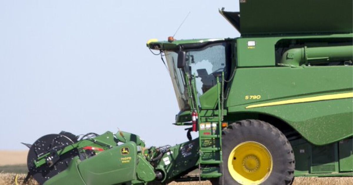A shattered window on the cab of a John Deere combine is seen at the site of where four people were killed in a reported murder-suicide in Towner County, North Dakota.
