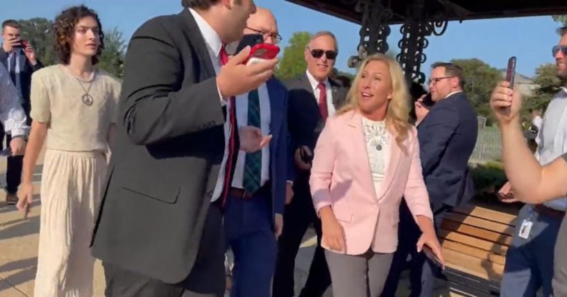 Anti-gun activists confront Republican Rep. Marjorie Taylor Greene in Washington.