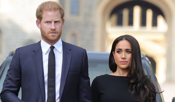 Prince Harry, Duke of Sussex, and Meghan, Duchess of Sussex arrive at Windsor Castle to view flowers and tributes to Queen Elizabeth II on Saturday.