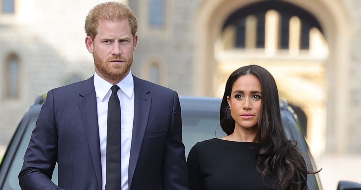 Prince Harry, Duke of Sussex, and Meghan, Duchess of Sussex arrive at Windsor Castle to view flowers and tributes to Queen Elizabeth II on Saturday.