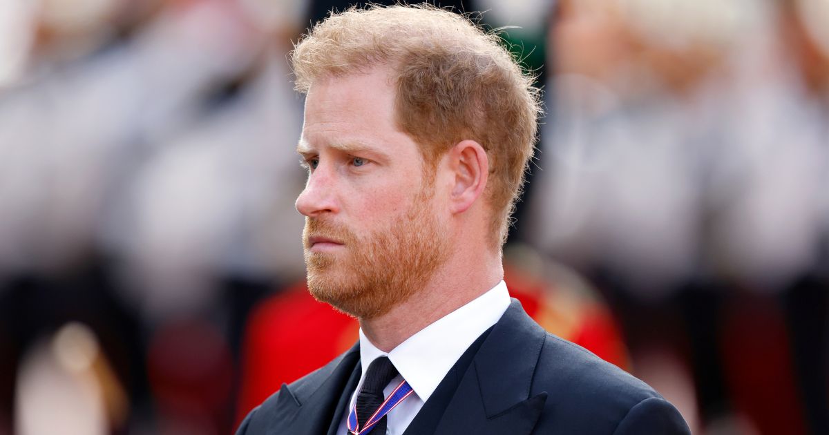 Prince Harry, Duke of Sussex, walks behind Queen Elizabeth II's coffin as it is transported on a gun carriage from Buckingham Palace to the Palace of Westminster in London on Wednesday.
