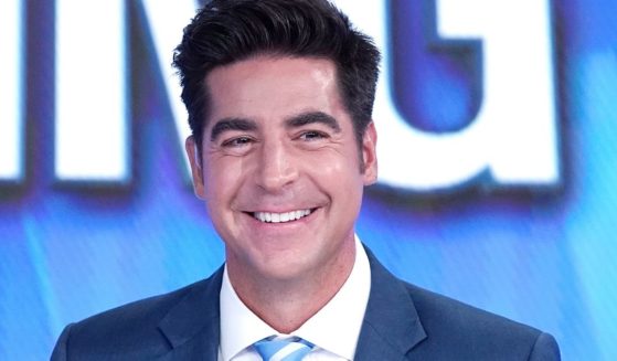 Fox News host Jesse Watters smiles during a segment at the network's studios in New York City on Sept. 12, 2019.