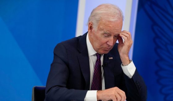 Joe Biden listens during an event