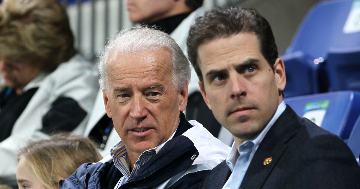Then-Vice-President Joe Biden, left, and his son Hunter Biden are seen in a file photo attending a women's ice hockey game in February 2010.