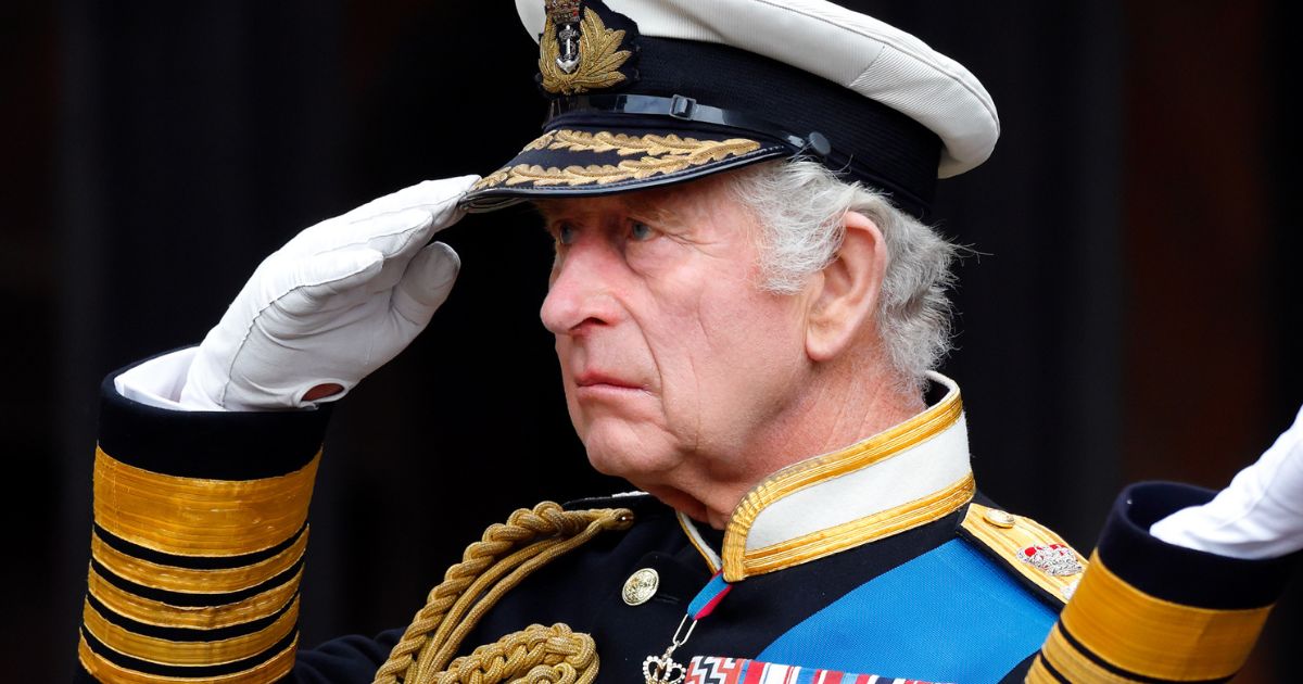 King Charles III salutes as he attends the committal service for Queen Elizabeth II at St George's Chapel on Sept. 19 in Windsor, England.