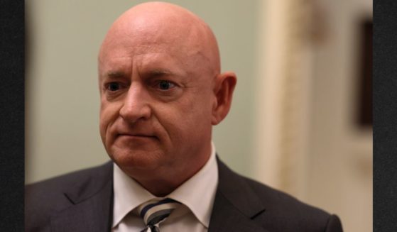 Democratic Sen. Mark Kelly of Arizona, seen at a June event, struggled to respond to an interviewer's question about what kind of job Joe Biden is doing.