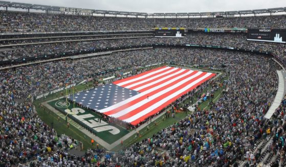 Prior to the game between the New York Jets and the Baltimore Ravens at MetLife Staium in East Rutherford, New Jersey, on Sunday fans joined in to sing the national anthem after the singers microphone cut out.