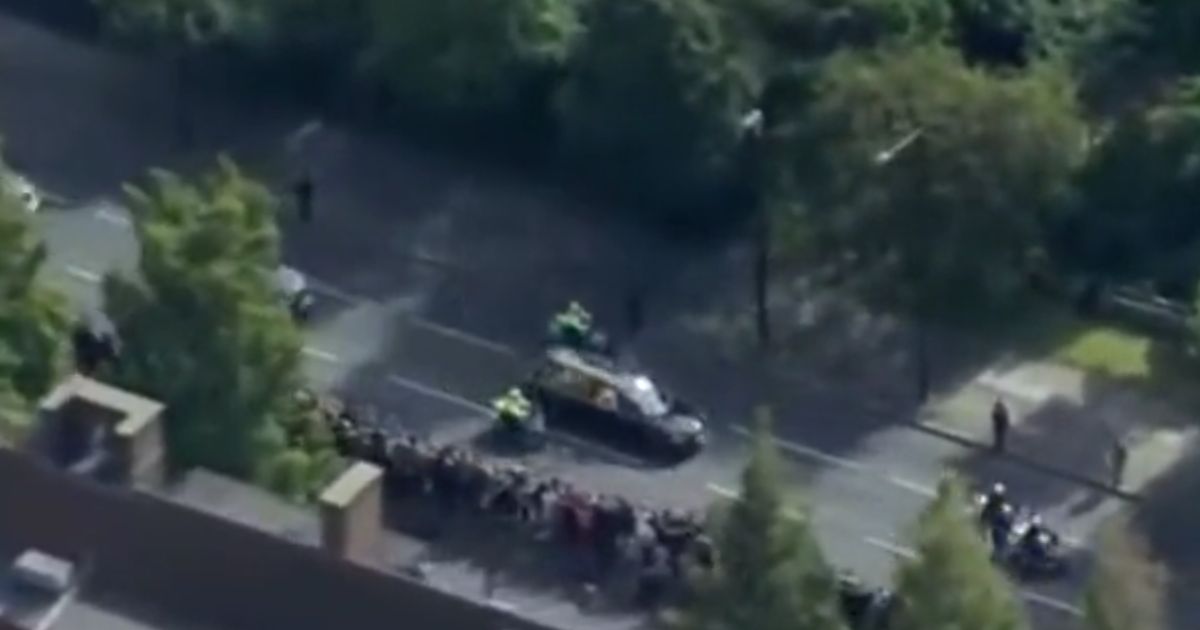 A ghostly whisper was heard during an ITV broadcast an aerial view of the hearse bearing Queen Elizabeth II's coffin across London Monday.