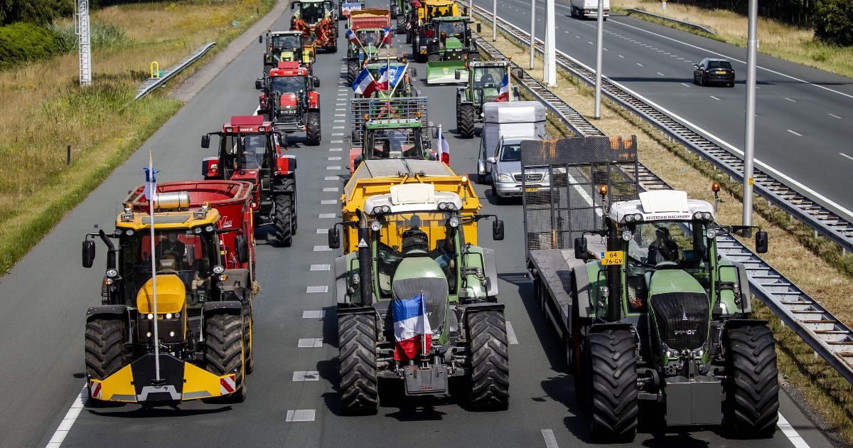 Farmers protest government nitrogen rules by driving their tractors on the A35 motorway near Bornerbroek, Netherlands, on July 28.