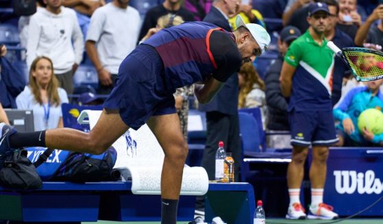 Nick Kyrgios of Australia smashes his racket after being defeated by Karen Khachanov in the quarterfinals of the U.S. Open at the Billie Jean King National Tennis Center on Wednesday in the Queens borough of New York City.