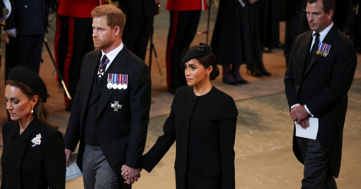 Catherine, Princess of Wales; Prince Harry, Duke of Sussex; Meghan, Duchess of Sussex; and Peter Phillips arrive in the Palace of Westminster after the procession for the lying-in-state of Queen Elizabeth II in London on Wednesday.