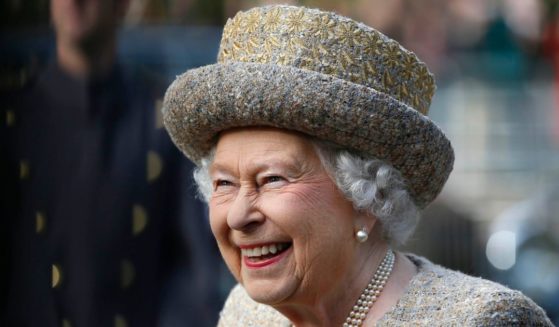 Queen Elizabeth II and her bodyguard had a good chuckle over their encounter with two Americans hiking in Scotland.