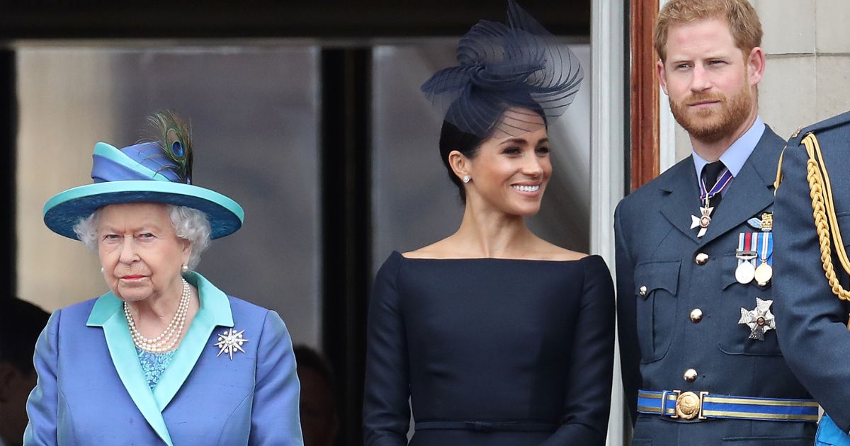 Queen Elizabeth II, Prince Harry, Duke of Sussex and Meghan, Duchess of Sussex stand on the balcony of Buckingham Palace on July 10, 2018, in London.