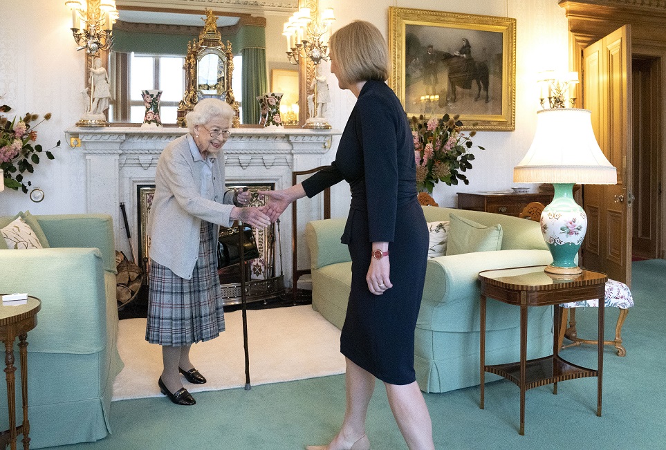Queen Elizabeth II greets newly elected leader of the Conservative Party Liz Truss as she arrives at Balmoral Castle in Aberdeen, Scotland, on Tuesday.