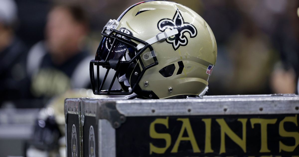 A New Orleans Saints helmet rests on Saints equipment on the sideline during a preseason game against the Los Angeles Chargers in New Orleans on Friday.
