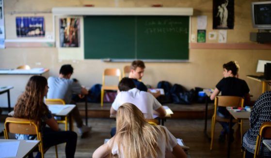 A classroom of students wait for the start of a test in philosophy as part of testing for the high school diploma in Paris on June 15, 2017.