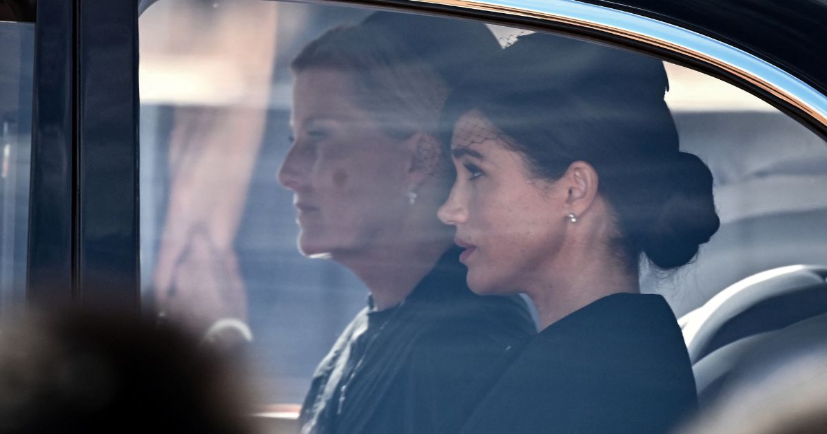 Sophie, Countess of Wessex, left, and Meghan, Duchess of Sussex are driven behind the coffin of Queen Elizabeth II during a procession from Buckingham Palace to the Palace of Westminster in London on Wednesday.