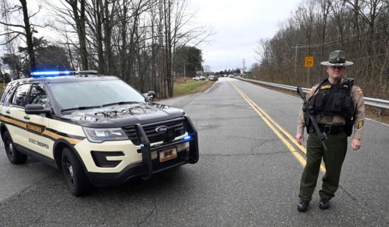 A Tennessee Highway Patrol officer blocks the road to McGhee Tyson Air National Guard Base in Alcoa, Tennessee, after reports were received of shots being fired Jan. 15, 2020.
