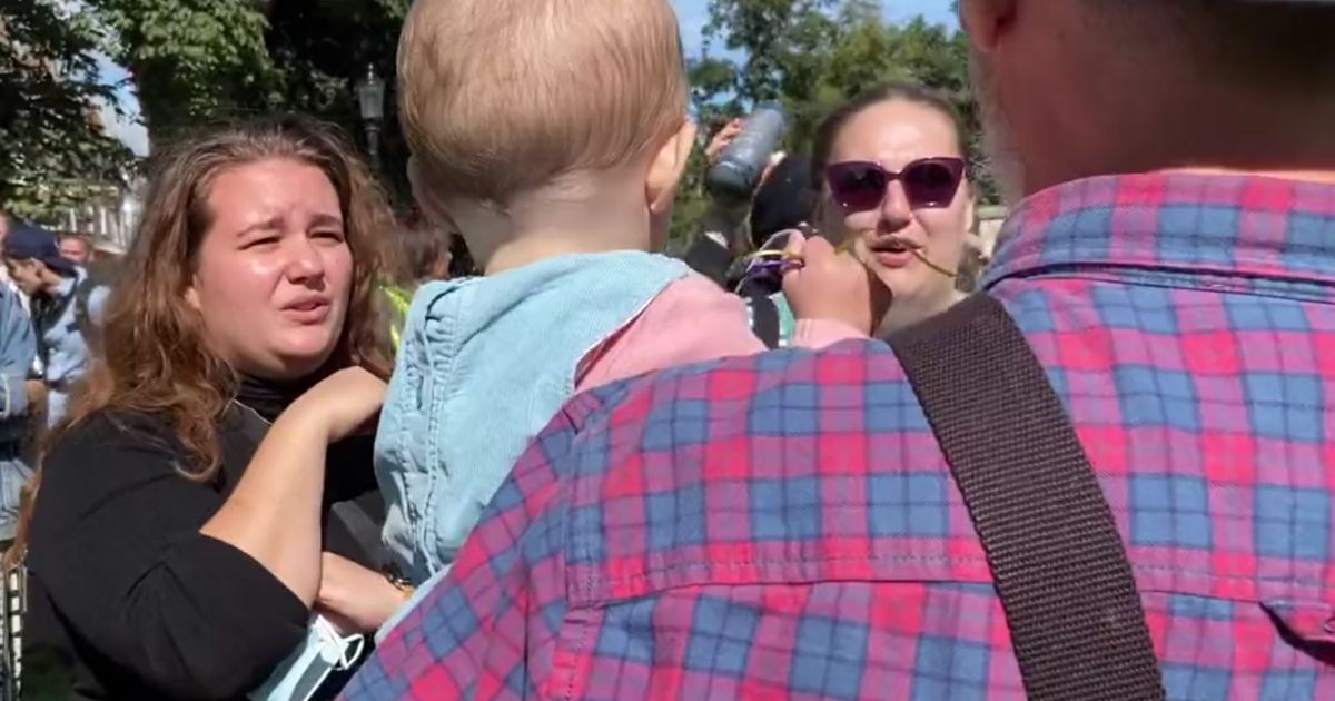 While attending a Let Women Speak rally in Brighton, England, a man and his baby were yelled at by two trans activist who accused the father of "raising a little fascist."