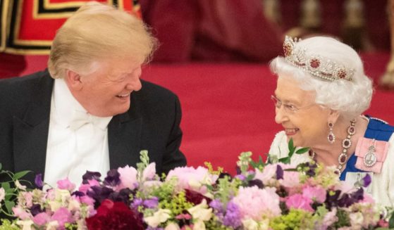 Then-President Donald Trump, left, attends a State Banquet with Queen Elizabeth II, right, at Buckingham Palace in London on June 3, 2019.