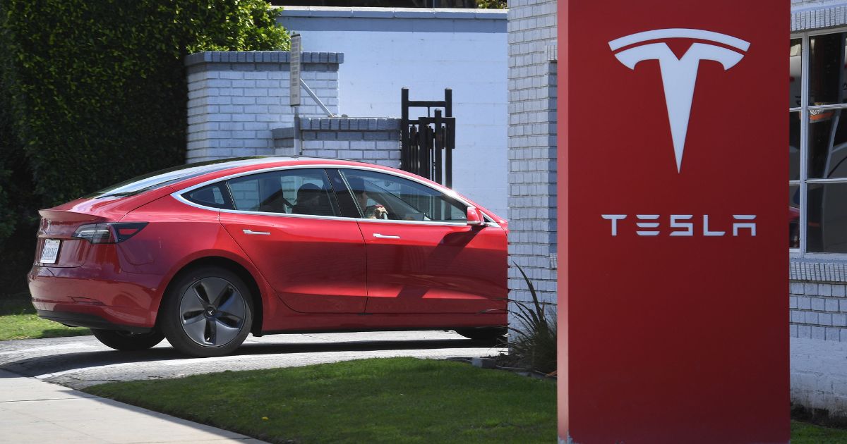 A Tesla arrives at a service center in a March 2019 file photo.