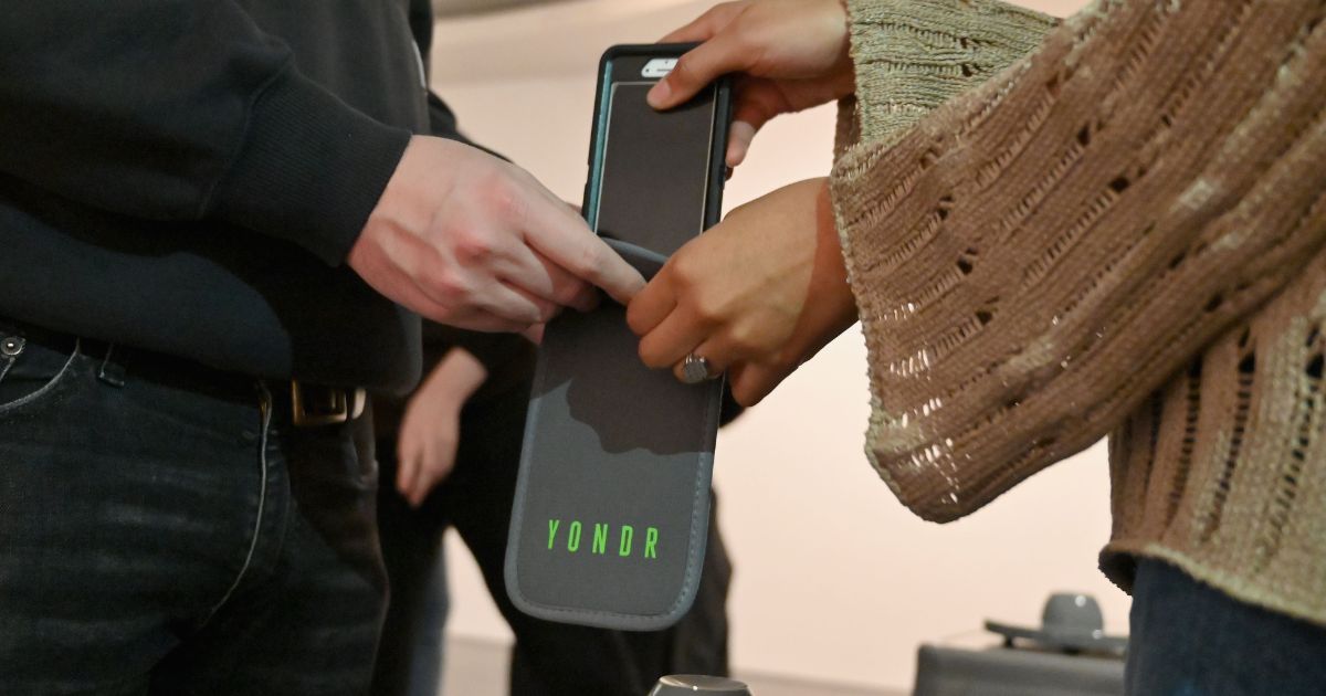 Mobile phones are locked into 'Yondr' pouches outside the Brooklyn Museum in 2019 in New York City.