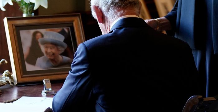 A calendar sits on a desk in front of King Charles III on Tuesday at Hillsborough Castle in Northern Ireland as Charles forgets the date.