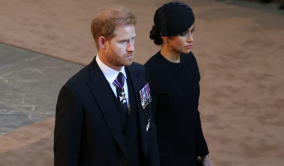 Prince Harry, Duke of Sussex, and Meghan, Duchess of Sussex are pictured as the coffin of Queen Elizabeth II is escorted into Westminster Hall on Wednesday.
