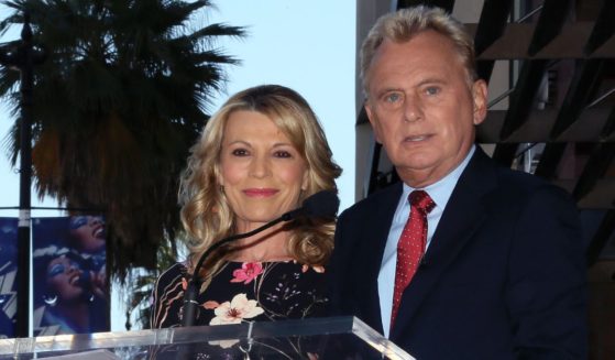 Longtime "Wheel of Fortune" host Pat Sajak is pictured in a 2019 file photo with longtime, letter-touching partner Vanna White.