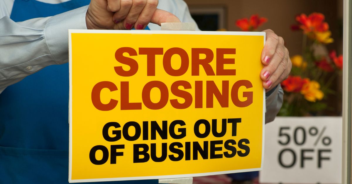 A ohoto illustration shows a "going out of business" sign going up in a store window.