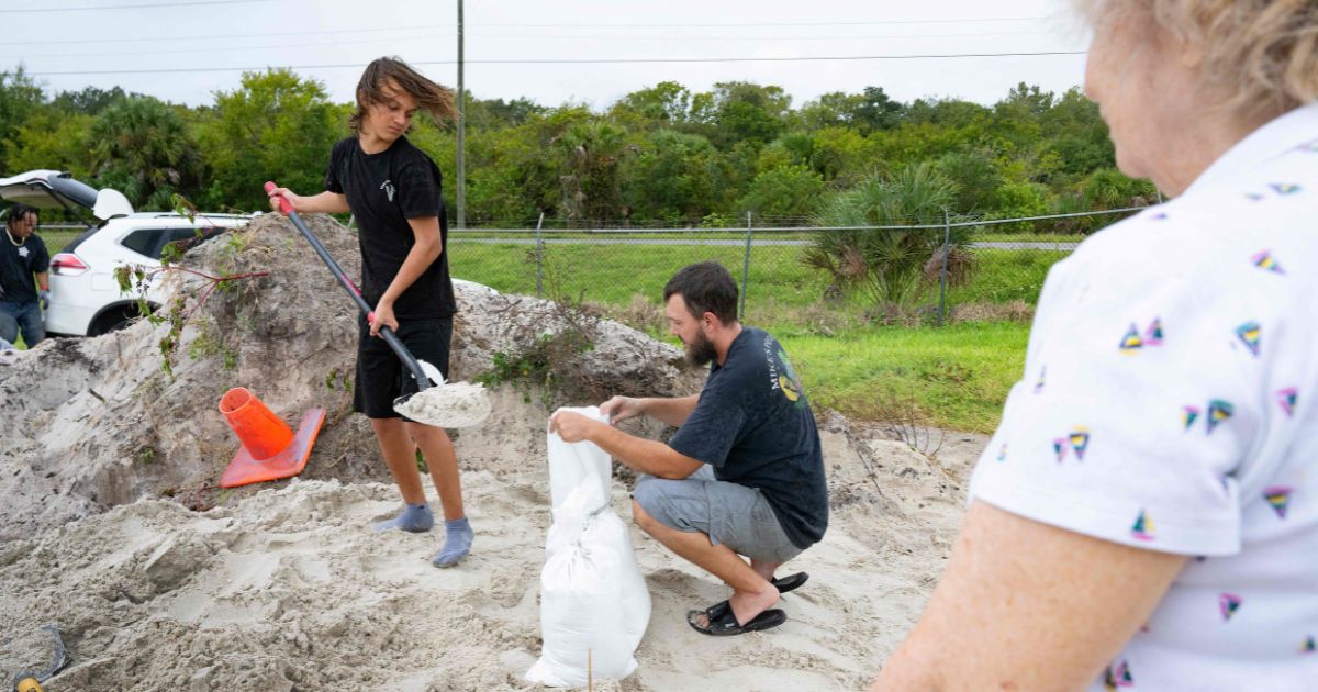 Edgewater, Florida, residents fill sandbags as the Sunshine State prepares for Hurricane Ian, which is expected to make landfall Wednesday.