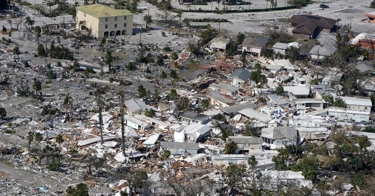 Damaged homes and debris are shown in Fort Myers Beach, Florida, on Thursday in the aftermath of Hurricane Ian.