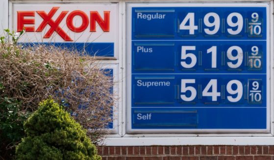 A gas sign is pictured at an Exxon station in Washington, D.C., in March. Exxon CEO Darren Woods says that "reducing global supply (of oil) by limiting U.S. exports to build region-specific inventory will only aggravate the global supply shortfall."