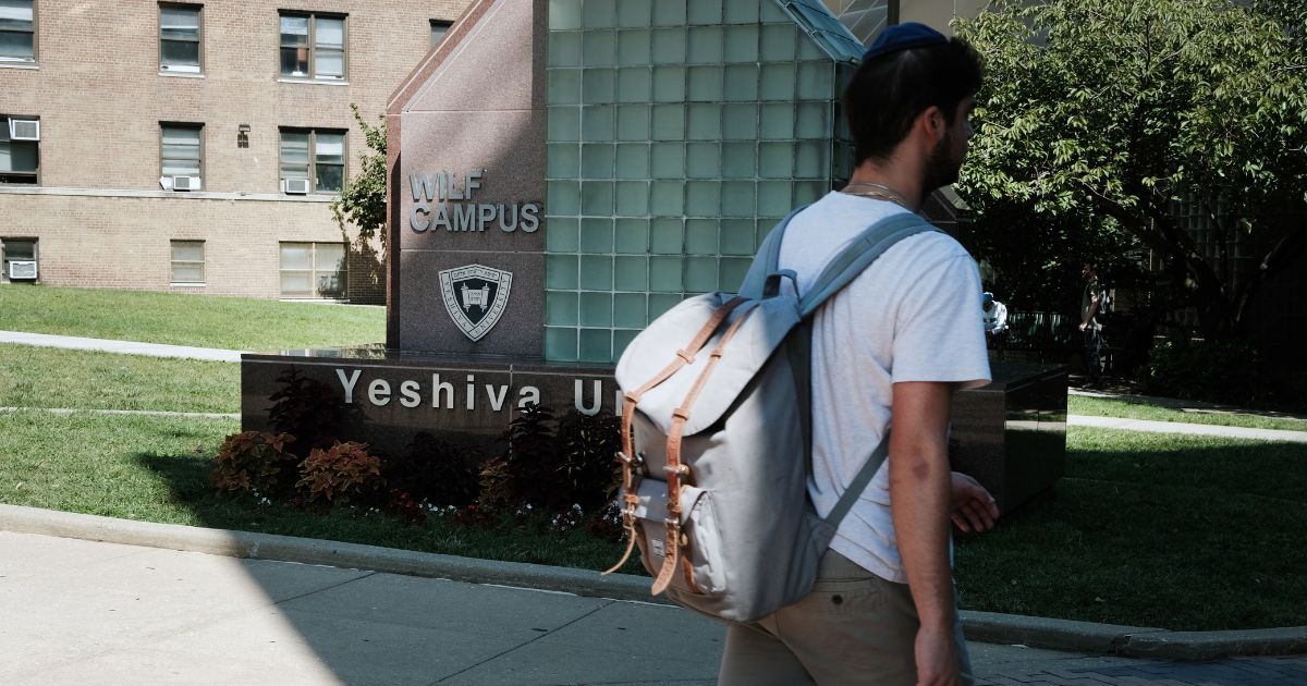 People walk through the campus of Yeshiva University in New York City on Aug. 30.