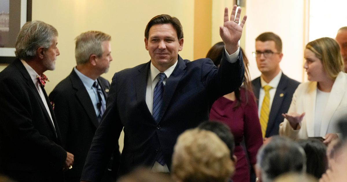 Florida Gov. Ron DeSantis waves as he arrives for a press conference to announce expanded toll relief for Florida commuters, on Wednesday in Miami.