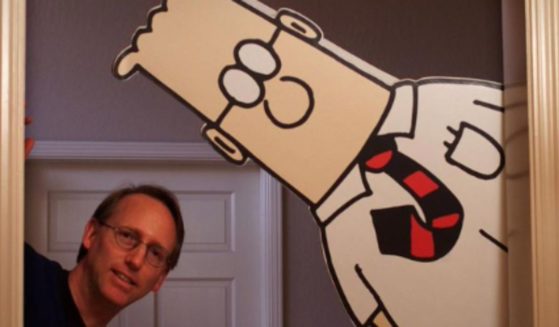 "Dilbert" author Scott Adams says that the comic strip has been canceled in 77 newspapers.