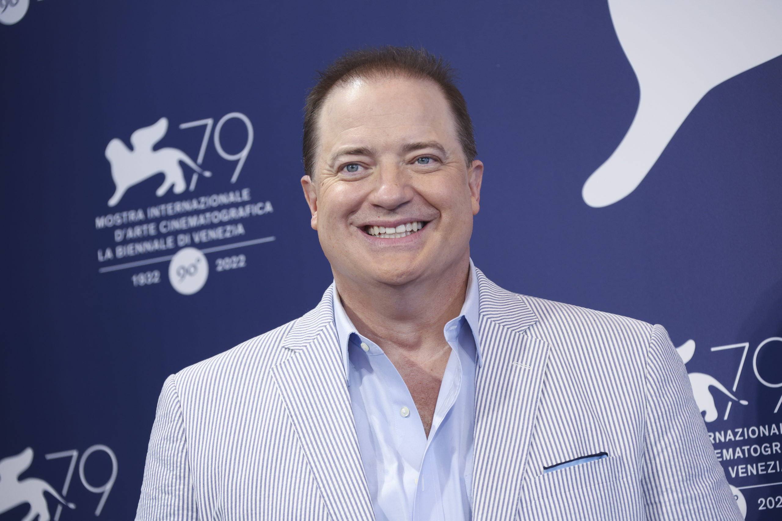 Brendan Fraser takes photos during the photo call for "The Whale," his new film debuting at the 79th edition of the Venice Film Festival in Venice, Italy on Sunday.