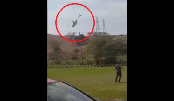 Two politicians and an aide plunged to the ground in a helicopter after their pilot struck power lines in southeastern Brazil on Wednesday.